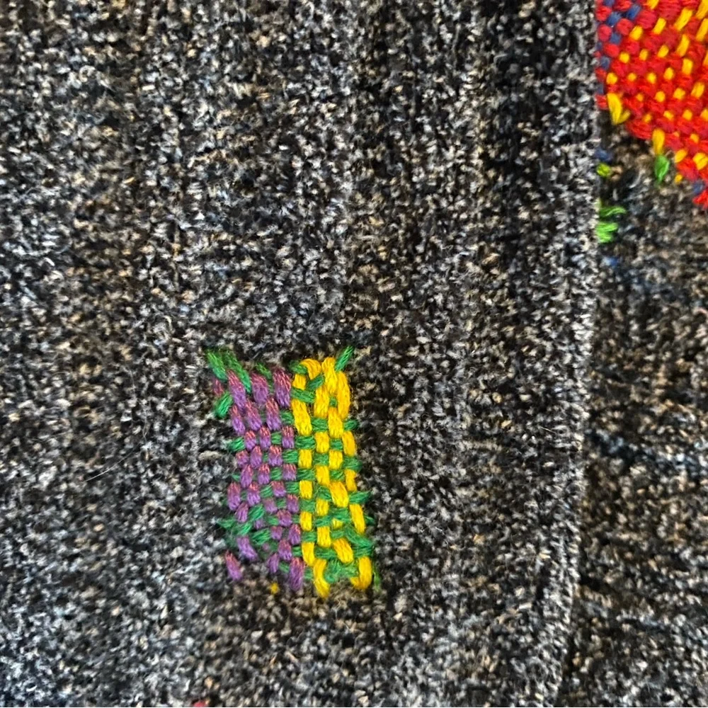 Super Soft Distressed Turtle Neck Sweater with Colorful Repairs.